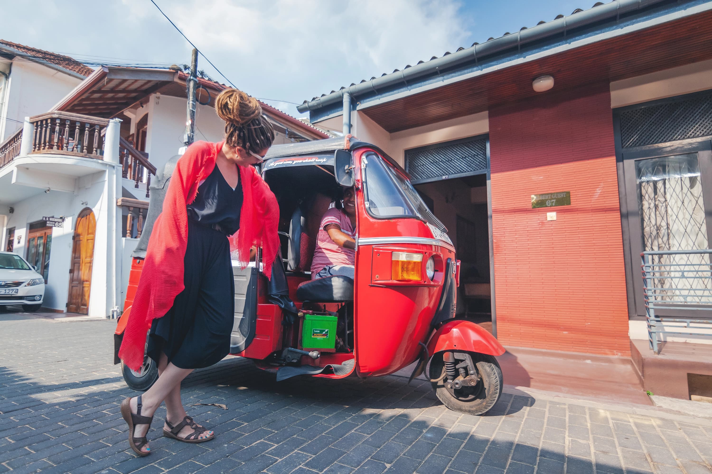 Lady on the side of a tuk tuk in Galle Sri Lanka